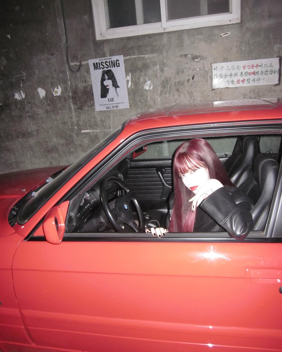 Lijzzie's tweet photo. leather wrapped in confidence, lips painted with quiet rebellion. A red car, concrete walls, and a city that doesn’t ask questions. I’m not running away, I’m just driving where I feel most alive. Cold air, warm lights, and a heart that knows exactly where it belongs. https://t.co/GbBq0LZkNH