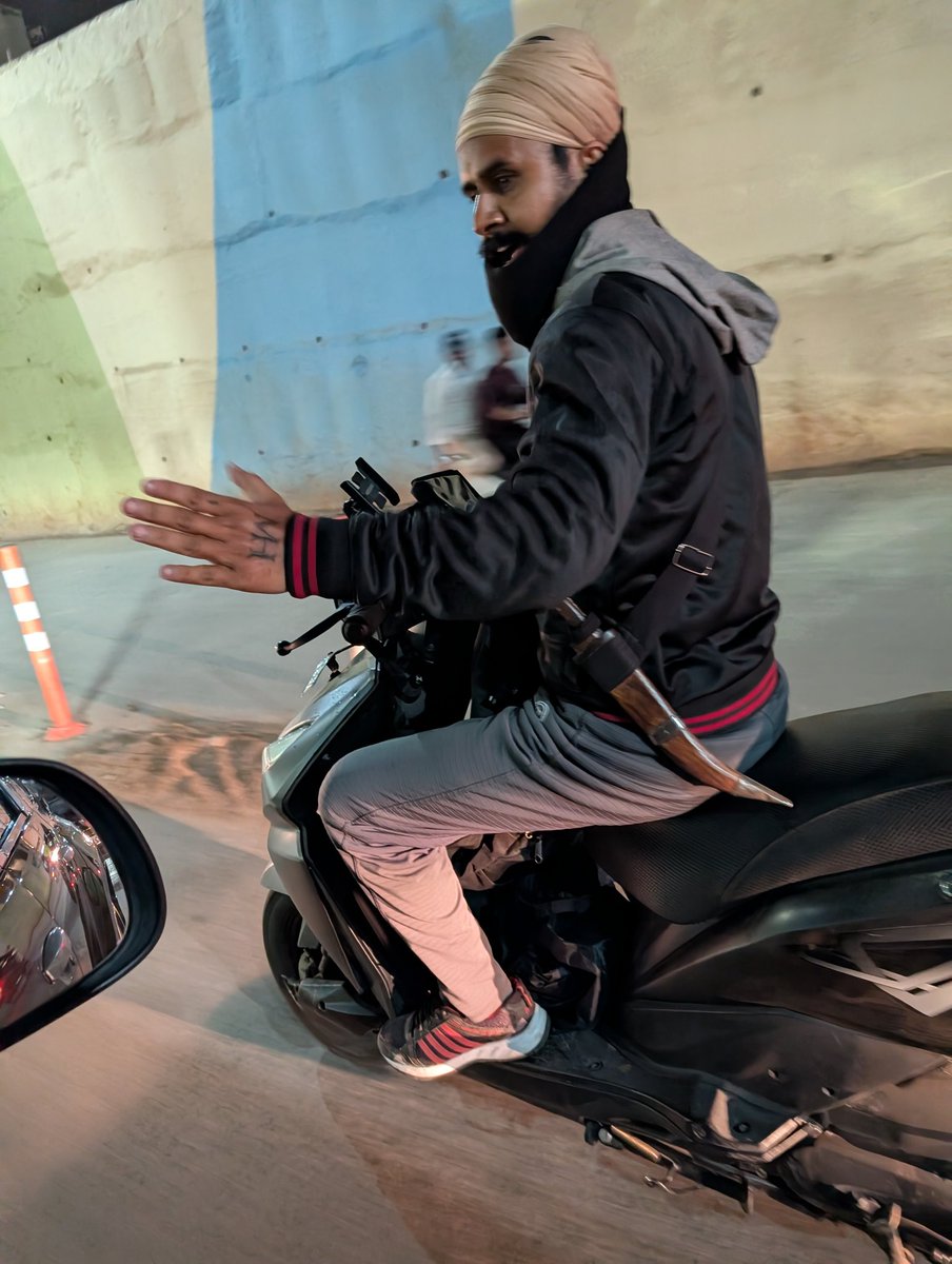 I would like to report a safety concern regarding a motorist on a scooter KA04 JS 5957 spotted at  Kodigehalli The individual was openly carrying a large, unsheathed blade, posing a potential risk to public safety and fellow commuters.
#BengaluruPolice <a href="/BlrCityPolice/">ಬೆಂಗಳೂರು ನಗರ ಪೊಲೀಸ್‌ BengaluruCityPolice</a>