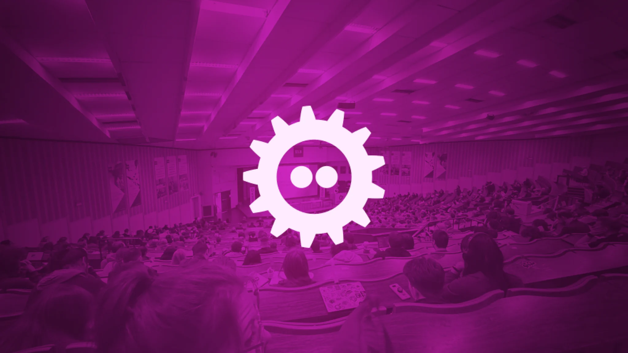 Photo edit of the main FOSDEM room with a purple shade and the white FOSDEM logo on top.