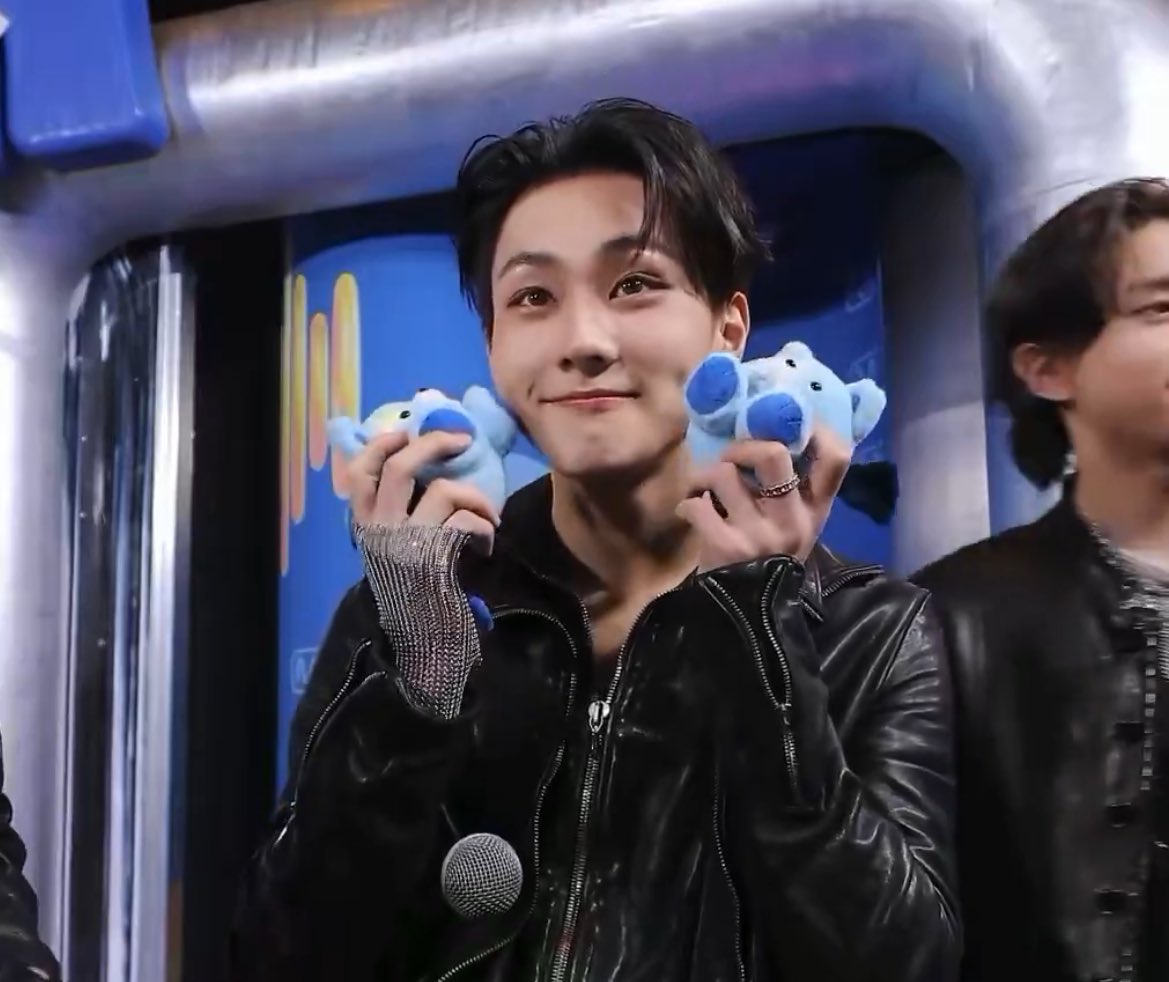 Just Jungwon holding his dolls. Cutie 🥹