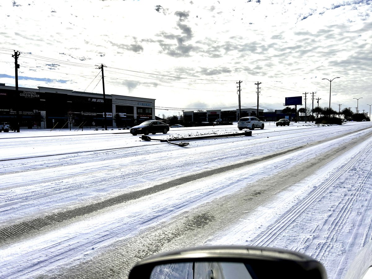The roads are completely covered in ice. Ice not snow north of Dallas. The temperature is well below freezing. 12° overnight. About 2 inches of sleet fell.

And people are driving 30 to 40 miles an hour on ice down the major roads. See what just happened.