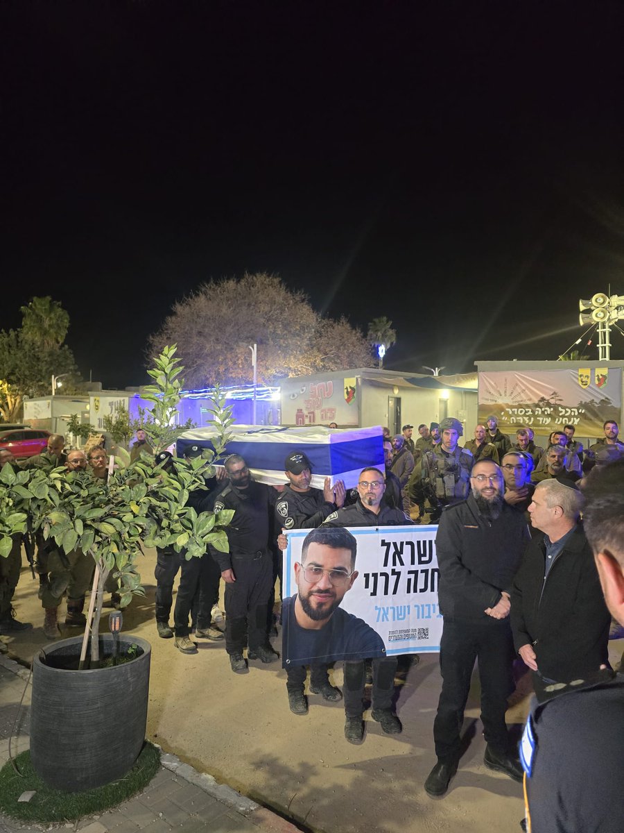 manniefabian's tweet image. A brief ceremony is being held by the police at the IDF's Nahal Oz base near the border with Gaza, in memory of slain policeman Master Sgt. Ran Gvili, whose body was recovered from the Strip today.

Gvili's father, Itzik, and Police Commissioner Daniel Levy are attending the…