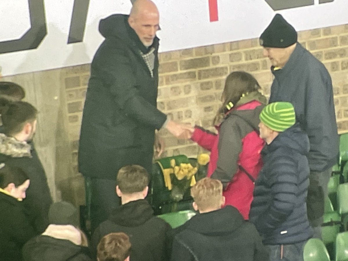 CGoreham's tweet image. A lovely touch. Philippe Clement in the bottom tier of the River End stand to lay a yellow and green scarf on the seat where Jim Davies, who died at the end of the last home game, used to sit. Warm embraces for family and friends too.