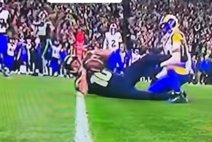 So this IS a catch and marked down because he hit the ground with the ball.

Interesting.
