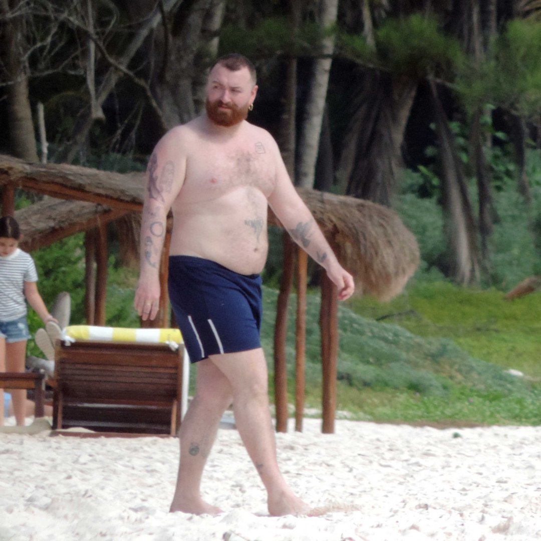 Sun, sand and Sam Smith. 🌴✨The singer went shirtless while enjoying a beach day in Mexico, flaunting their tattoos and laid-back vacation style. (📸: MEGA)