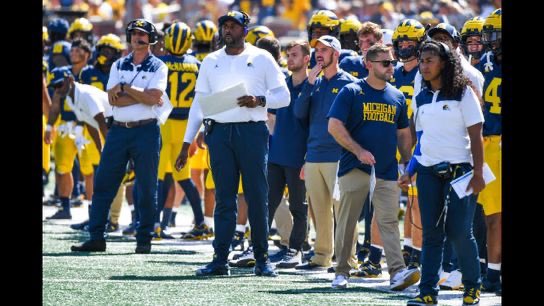 Flydog92's tweet image. One of many photos out there where he’s no where near the DC. He’d been right by Harbaugh a lot as well. He was helping both sides of the ball. There’s a video or two out there with Connor right by Sherrone while they were on offense.