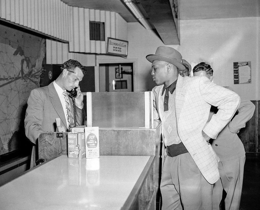 Willie Mays in Omaha getting a plane ticket to fly to New York City to make his MLB debut the next day, 1951. Mays was hitting .477 in AAA before the call up