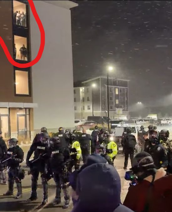paratroopbrady's tweet image. ICE agents drink beer and watch ice protestors act stupid outside their hotel lasntight. One even mooned them, legends. 🤣