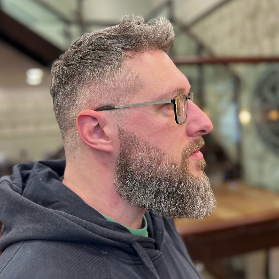 🎯 Clean fade. Sharp structure. Timeless style.

A classic short back and sides with a soft, textured top, finished with a subtle natural flow for a modern, effortless look. The fade is kept tight and clean around the temple and ear, blending seamlessly into the crown.