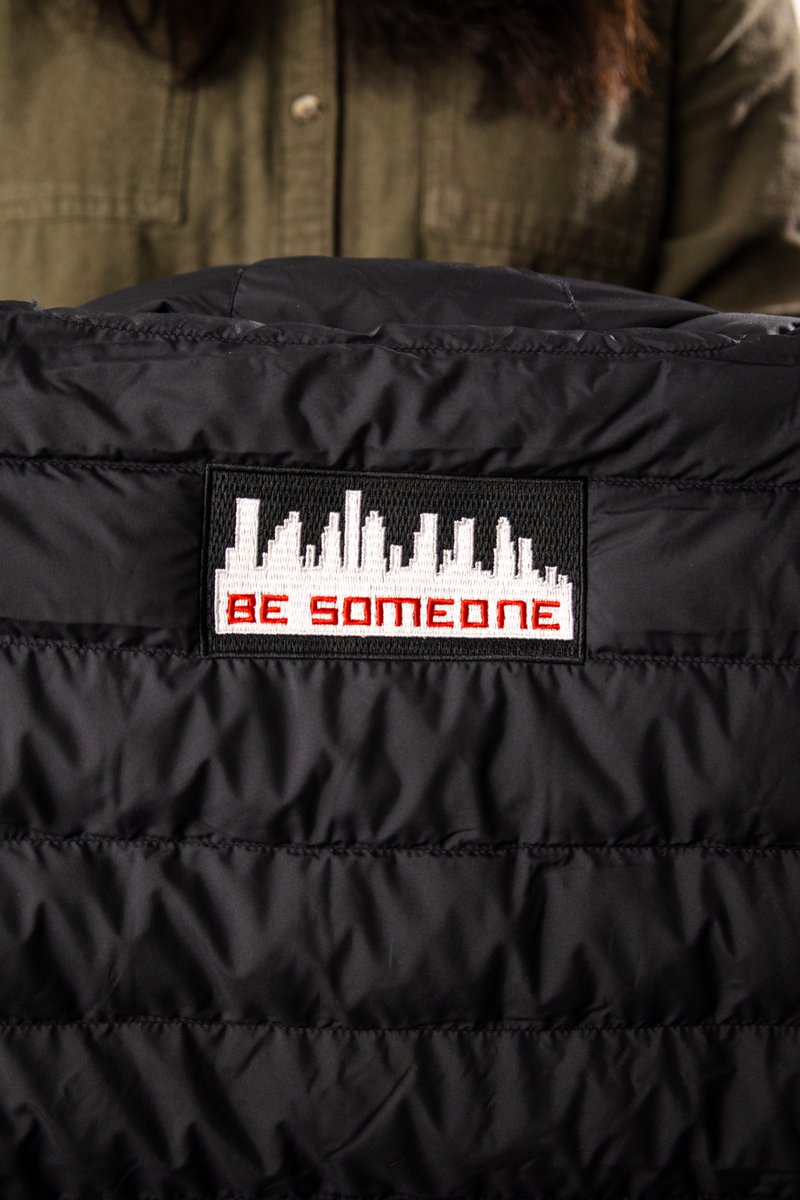 Custom puffer jacket featuring embroidered details and statement patches, streetwear designed to stand out and built to keep you warm and stylish through winter storms.