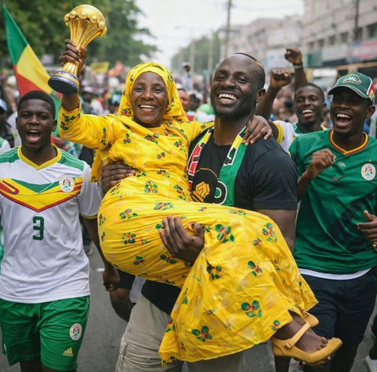 Sadio Mané was seen on the streets carrying his mother, honoring her as the mother of an AFCON champion. The joy on her face said everything—pure happiness and pride. Congratulations to the Mané family. As Senegalese people gathered around to support him, the moment became truly