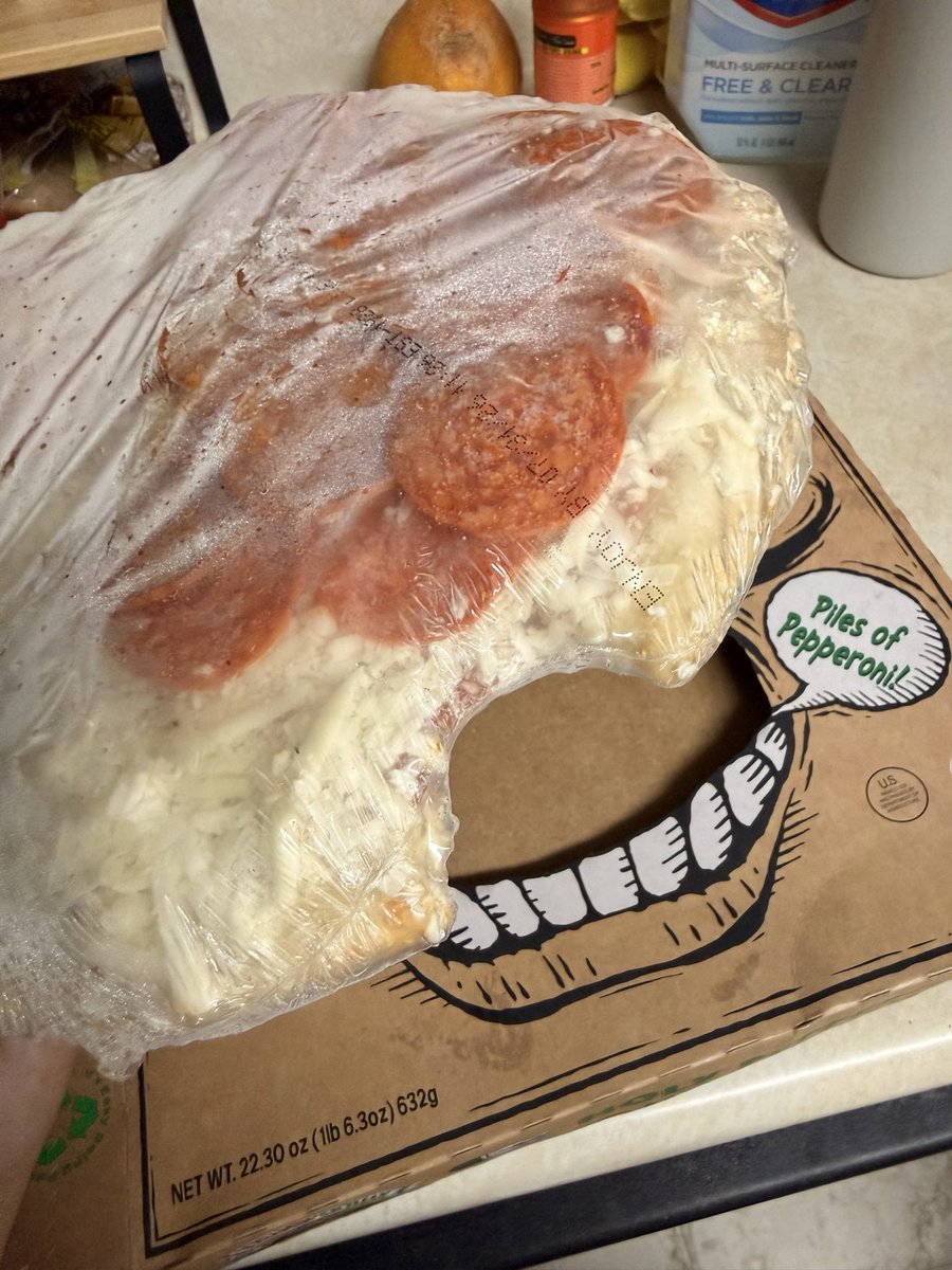 caseykoda's tweet photo. @screaminsicili1 please tell me why it looks like someone took a bite out of my unopened pizza. I immediately threw this away. https://t.co/Q7eeZkxy7K