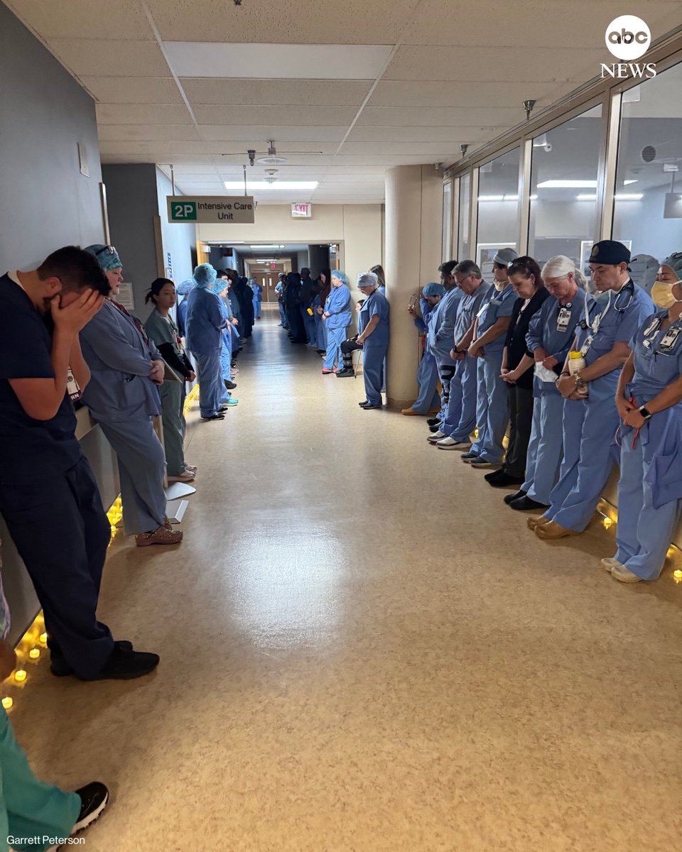 ABC's tweet photo. Photos taken at the Minneapolis VA Medical Center, where Alex Pretti used to work, show medical staff holding a moment of silence on Monday in honor of their late colleague. https://t.co/rMX5FHjSIx https://t.co/y40YpSlENF