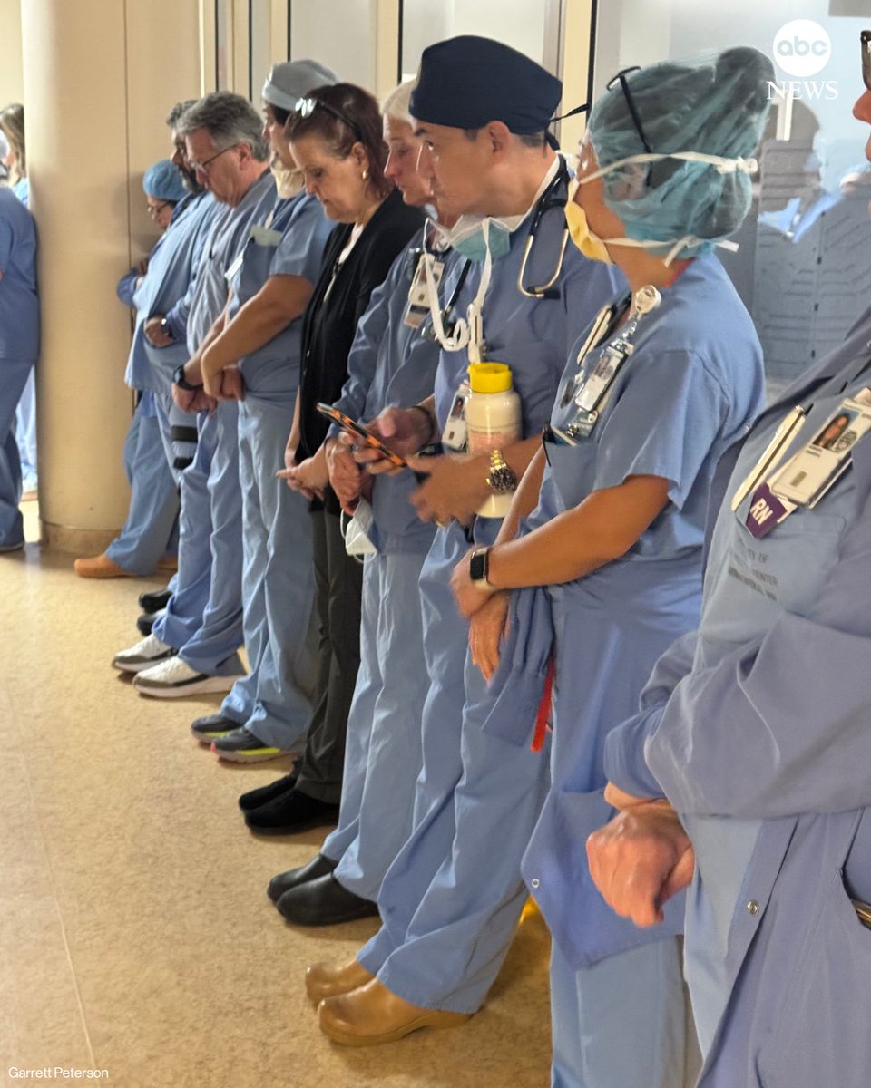 ABC's tweet photo. Photos taken at the Minneapolis VA Medical Center, where Alex Pretti used to work, show medical staff holding a moment of silence on Monday in honor of their late colleague. https://t.co/rMX5FHjSIx https://t.co/y40YpSlENF