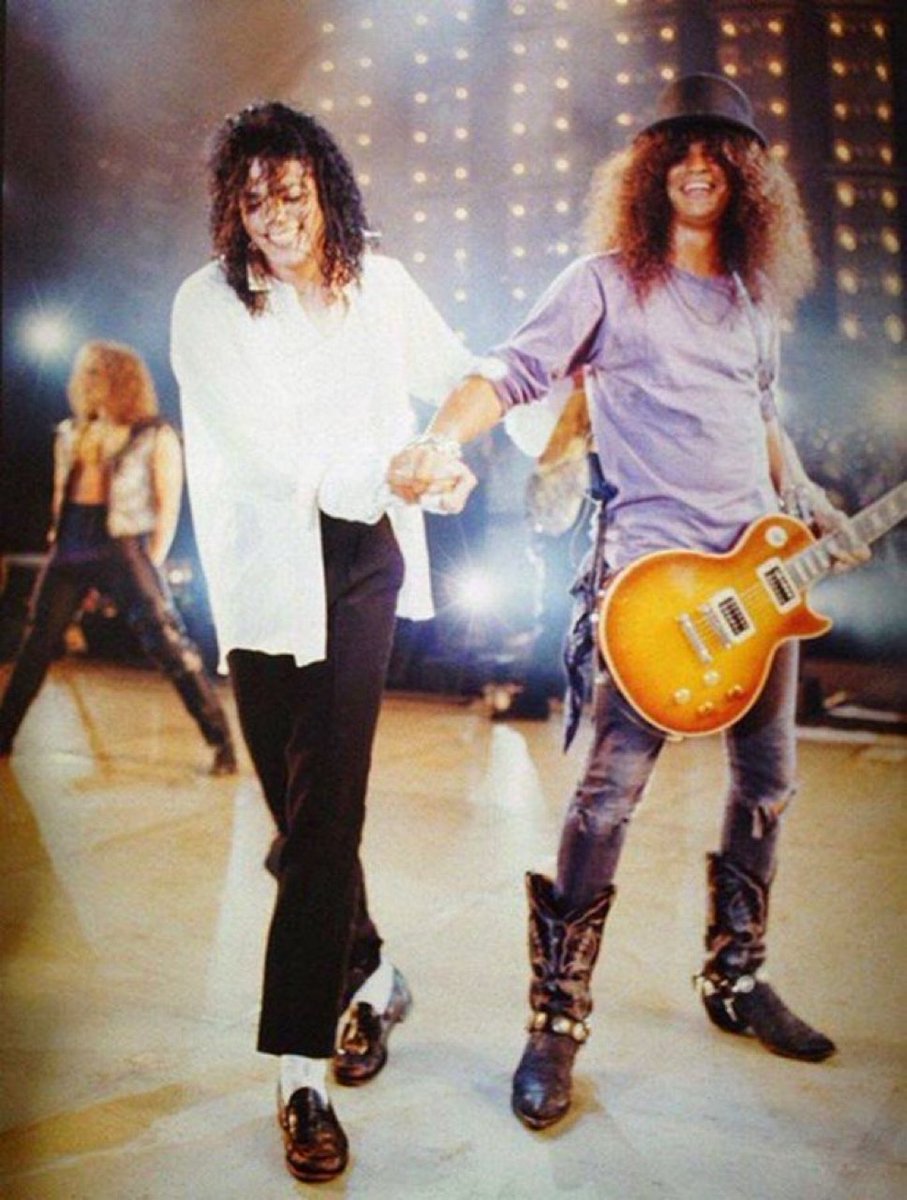 Michael Jackson and Slash on stage in 1995