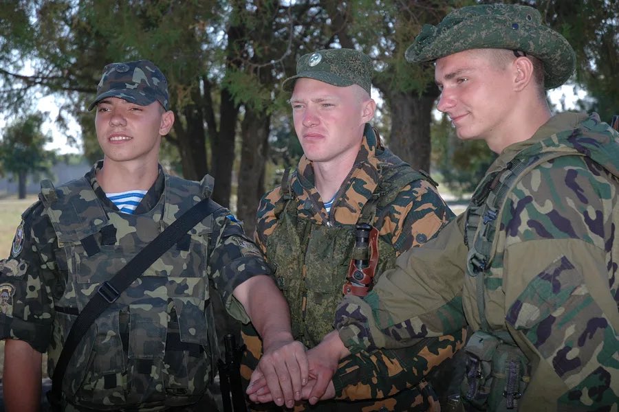 Ukrainian, Russian and Belarusian paratroopers taking a photo together during exercise “Slavic Commonwealth 2012”.