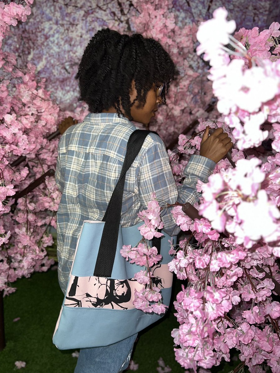 RareYonder's tweet photo. Mora holding the two toned tote bag in the cherry blossom room- Archives from 2023 https://t.co/ekSsr4XPfQ
