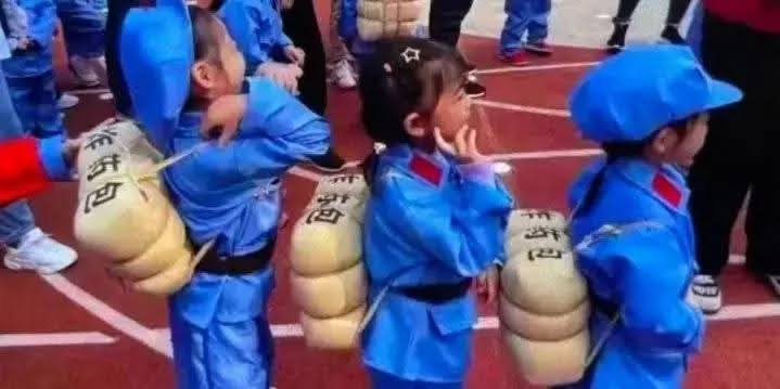 TWCommanderCat's tweet image. So what kind of education is this? Teaching kids to be fucking creepers?

The Chinese characters on the backpack are: 'explosive packs'