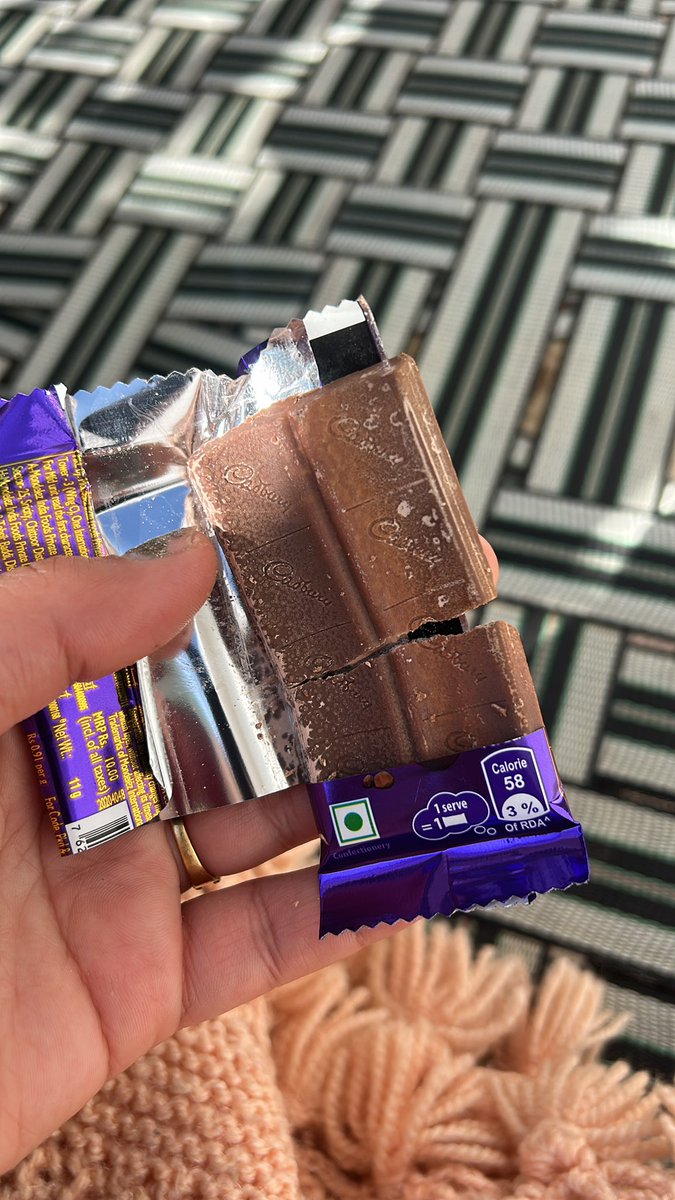 treasured_Hania's tweet photo. @DairyMilkIn I opened dairy milk today and this is what I found inside 😨completely spoiled-looking. This is not the quality expected from a brand like yours. Where is the concern of customer health and safety? 
This is alarming. Please look into this immediately. https://t.co/1HM47eH0NL