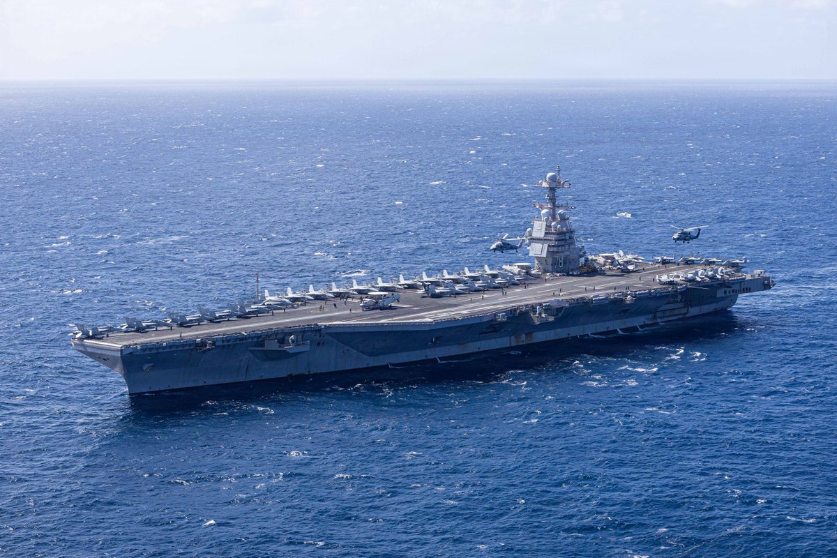 USNavy's tweet photo. Show of force 💪⚓

U.S. Navy Carrier Air Wing 8 aircraft fly in formation over the world’s largest aircraft carrier, Ford-class aircraft carrier USS Gerald R. Ford (CVN 78), during Carrier Air Wing 8’s aerial change of command ceremony while underway in the Caribbean Sea. 

U.S. military forces are deployed to the Caribbean in support of the U.S. Southern Command mission, Department of War-directed operations, and the president’s priorities to disrupt illicit drug trafficking and protect the homeland. #PeaceThroughStrength