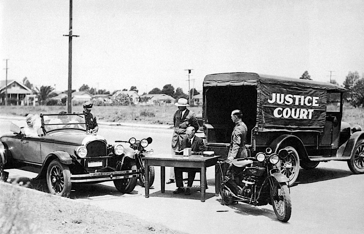 Someone in the Inglewood area of LA thought the law would be more efficient if an on-call judge could rush to the scene of the crime when an over-enthusiastic speed demon went over the limit and justice could be dispensed on the spot. This photo is from July 1926.