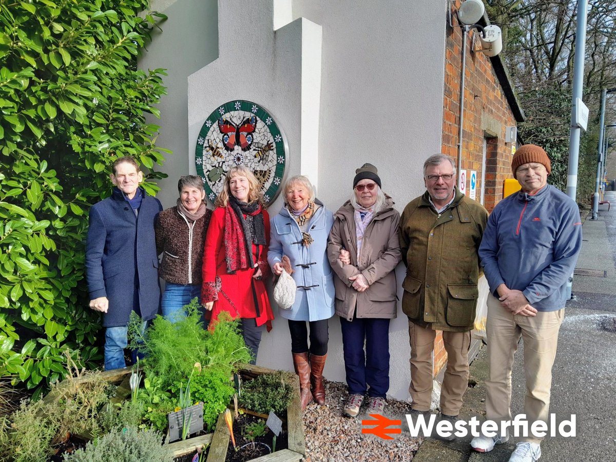 EastSuffolkLine's tweet photo. A mosaic roundel was unveiled today @greateranglia #Westerfield. Adopter Sandy Burn came up with the idea. Entitled 'Pollinators,' it features a butterfly, wasp, hoverfly, bumblebee, beetle & mot. It was inspired by the wildlife seen in the station garden. https://t.co/mxbGweT6J2