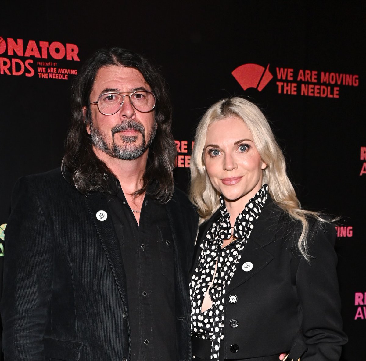 consequence's tweet image. Dave Grohl and Jordyn Blum wore "ICE OUT" pins to the Resonator Awards  

📸: Christopher Polk