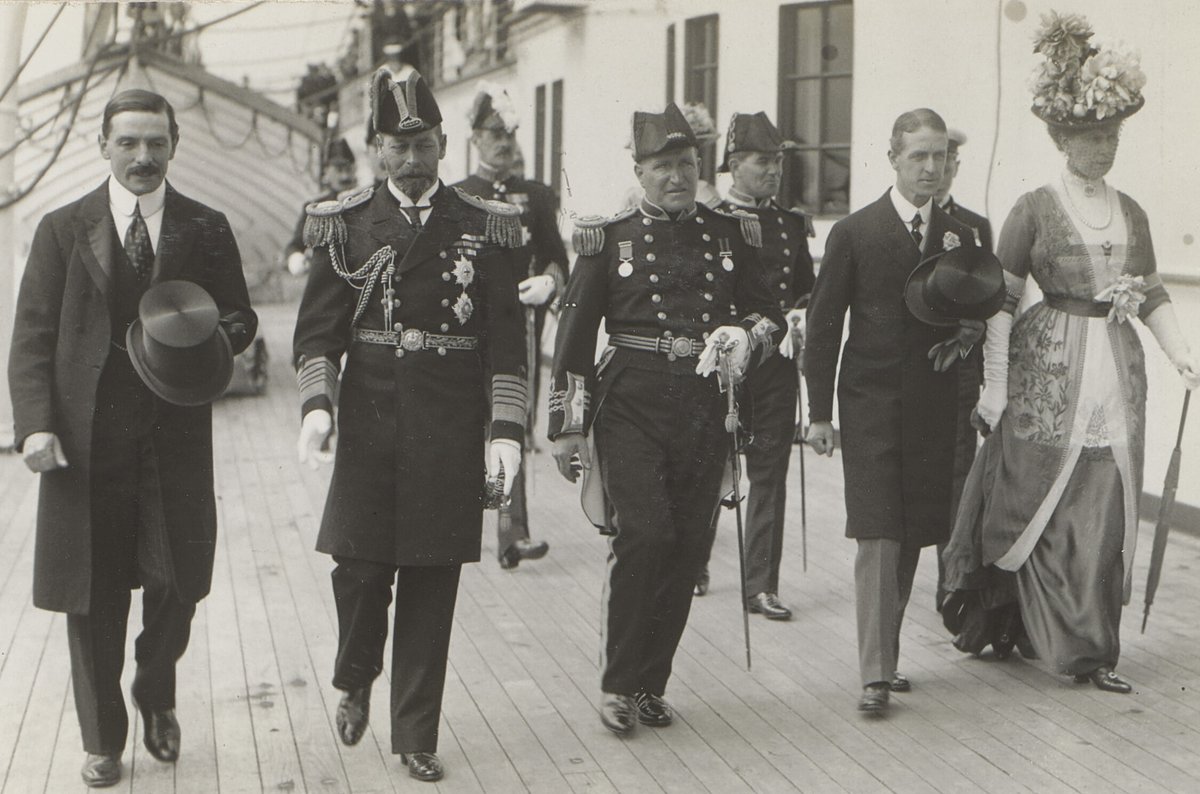 King George V and Queen Mary touring the Cunard liner RMS Mauretania during a visit to Liverpool in 1913 accompanied by Cunard chairman Alfred Allen Booth and Captain William Turner wearing his uniform as a Commander in the Royal Naval Reserve. (Royal Collection Trust).