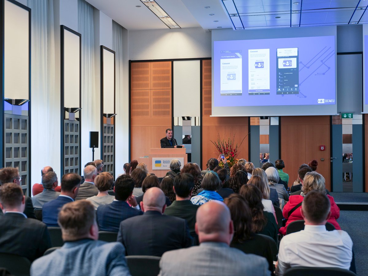 DC4EU_project's tweet photo. Mathias Landeck and Thomas Ebbinghaus presenting #DC4EU aim to digitise and verify #EHIC and #PDA1 at the 13th European Colloquium hosted by the Federal German Pension Insurance #DRVBund on 15 & 16 October 2024. #EUDIW #citizensidentity #digitaldocuments https://t.co/fYWaWDKyDi https://t.co/pJzoxc4EFr