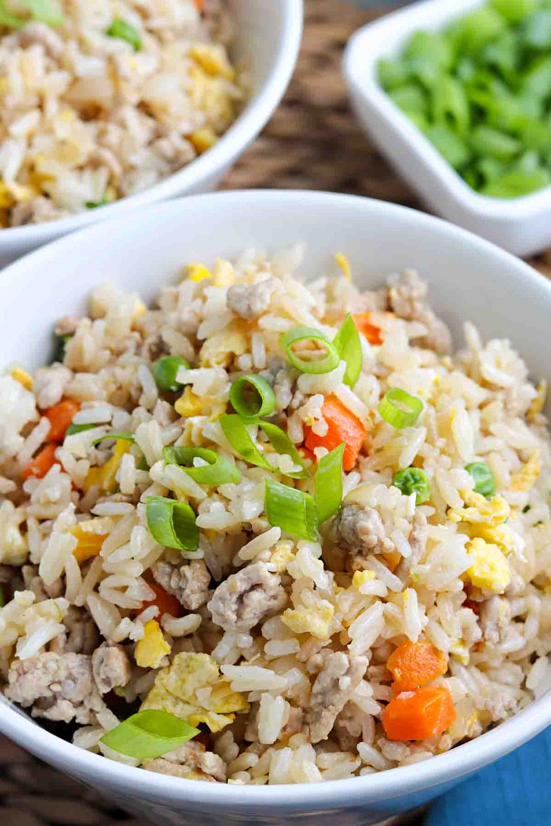 How to make the best Chinese pork fried rice recipe just like the restaurants make it with ground pork, eggs, and leftover white rice. Why spend money going out when you can make this budget-friendly recipe at home? adventuresofmel.com/pork-fried-ric…
