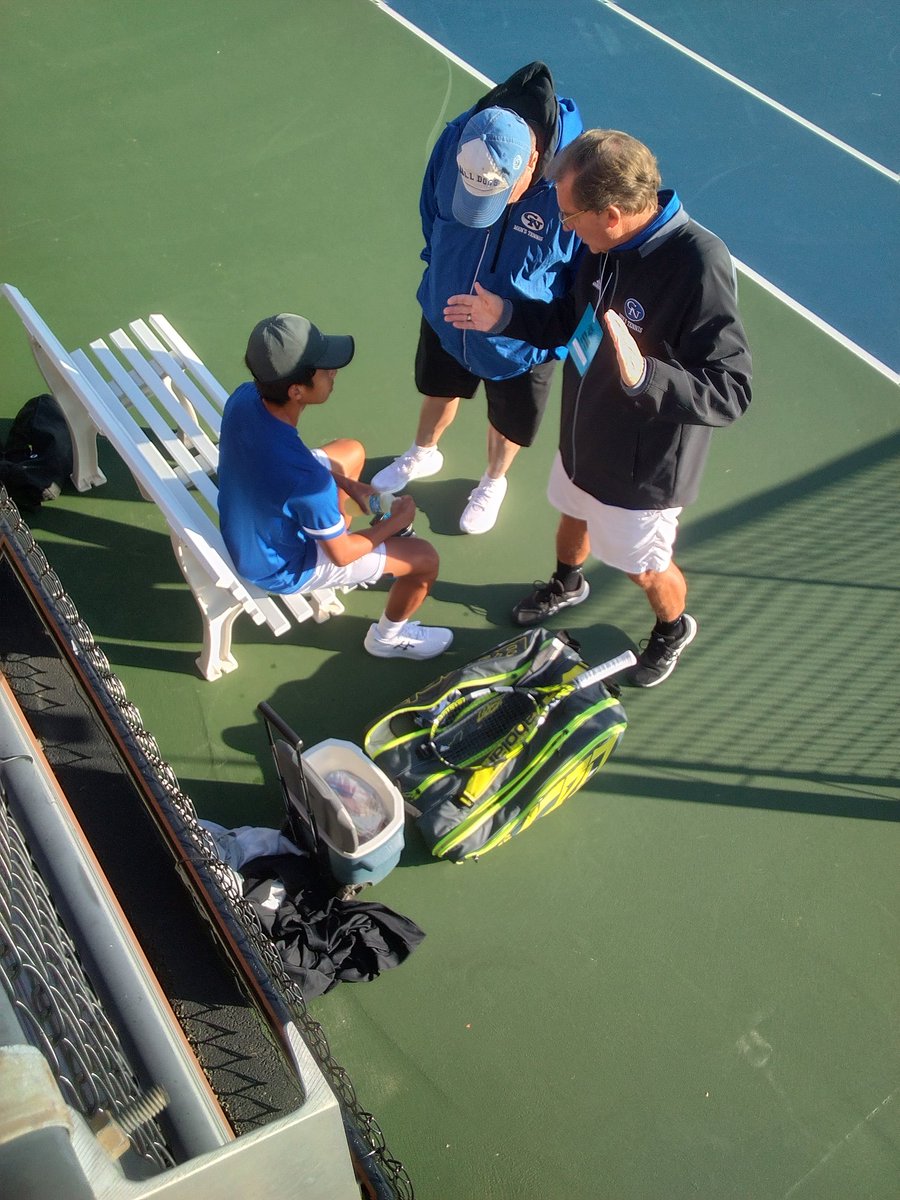Columbus North's Hank Lin, left, shown with assistant coach Robin Cain and head coach Kendal Hammel during a changeover, beat Fairfield's Garrett Stoltzfus 6-2, 6-3 in this morning's Boys Tennis State Singles semifinals and will play for the title at 2 p.m.