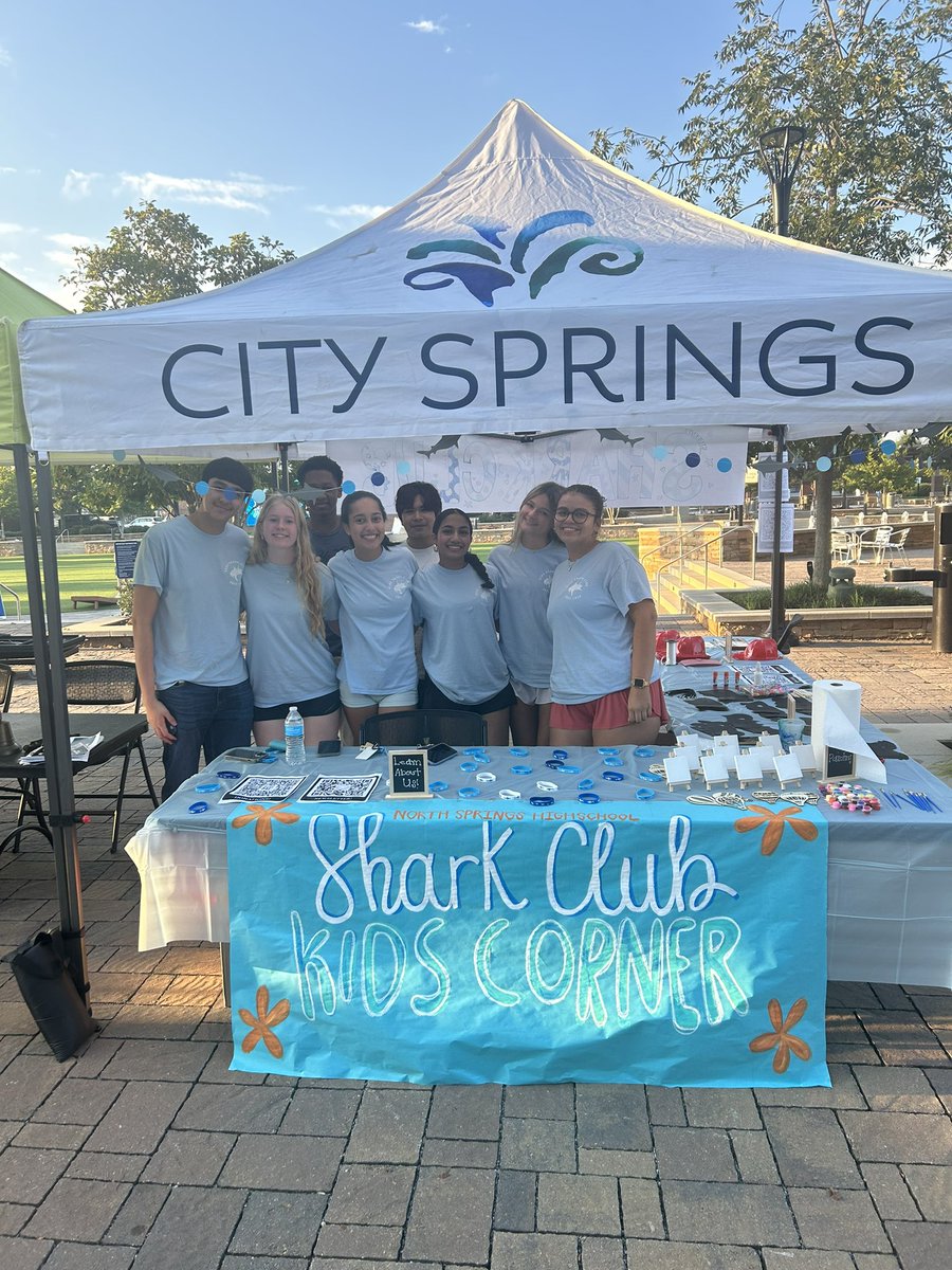 NSHSTheLink's tweet photo. Thanks to the city of Sandy Springs for partnering with the student community coalition “Shark Club” by providing a kid’s corner for the community.  We appreciate our partners!! @SandySpringsGA @FCS_NSHS_Princ @FultonCoSchools @MelodyKelleyPhD https://t.co/crEB37J1V7
