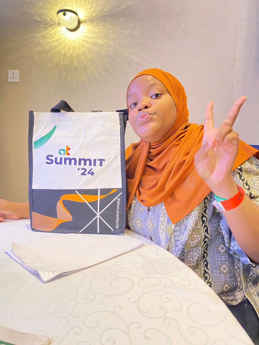 lailah_grant's tweet photo. A big thank you to @Africastalking for the awesome tote bag! I’m absolutely loving it—perfect for carrying all the great ideas from #ATSummit24! Your thoughtful gesture made my day, and I can’t wait to keep building with AT. #BuildWithAT #WeLoveNerds #InnovatingAfricasFuture https://t.co/XFAIPK6KQ1