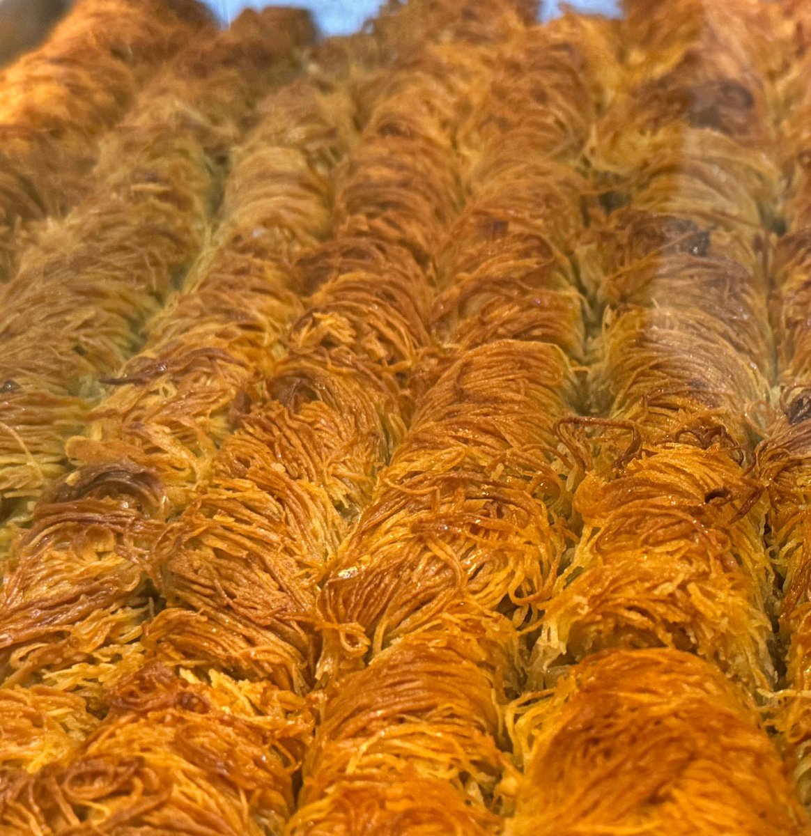 “New on the menu at Cafesserie: Kadif Baklava! For the next 3 days, enjoy this deliciously crispy, nutty treat for only 1000 UGX each! ✨ Don’t miss this limited-time offer to try our unique twist on baklava. #NewAtCafesserie #KadifBaklava #Promotion”