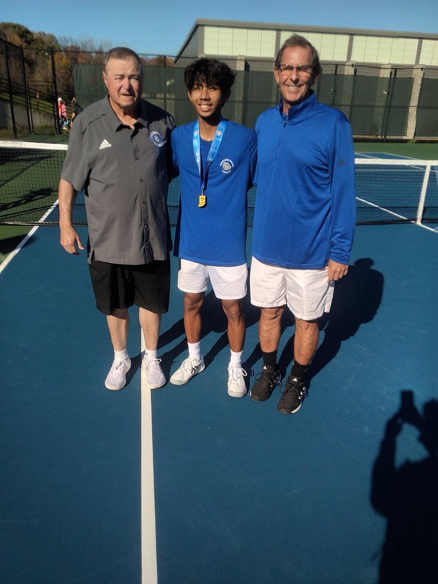Hank Lin, shown with assistant coach Robin Cain and head coach Kendal Hammel, is Columbus North's first Boys Tennis State Singles champion after topping Center Grove's Tyler Lane 6-4, 6-2 in the final.
