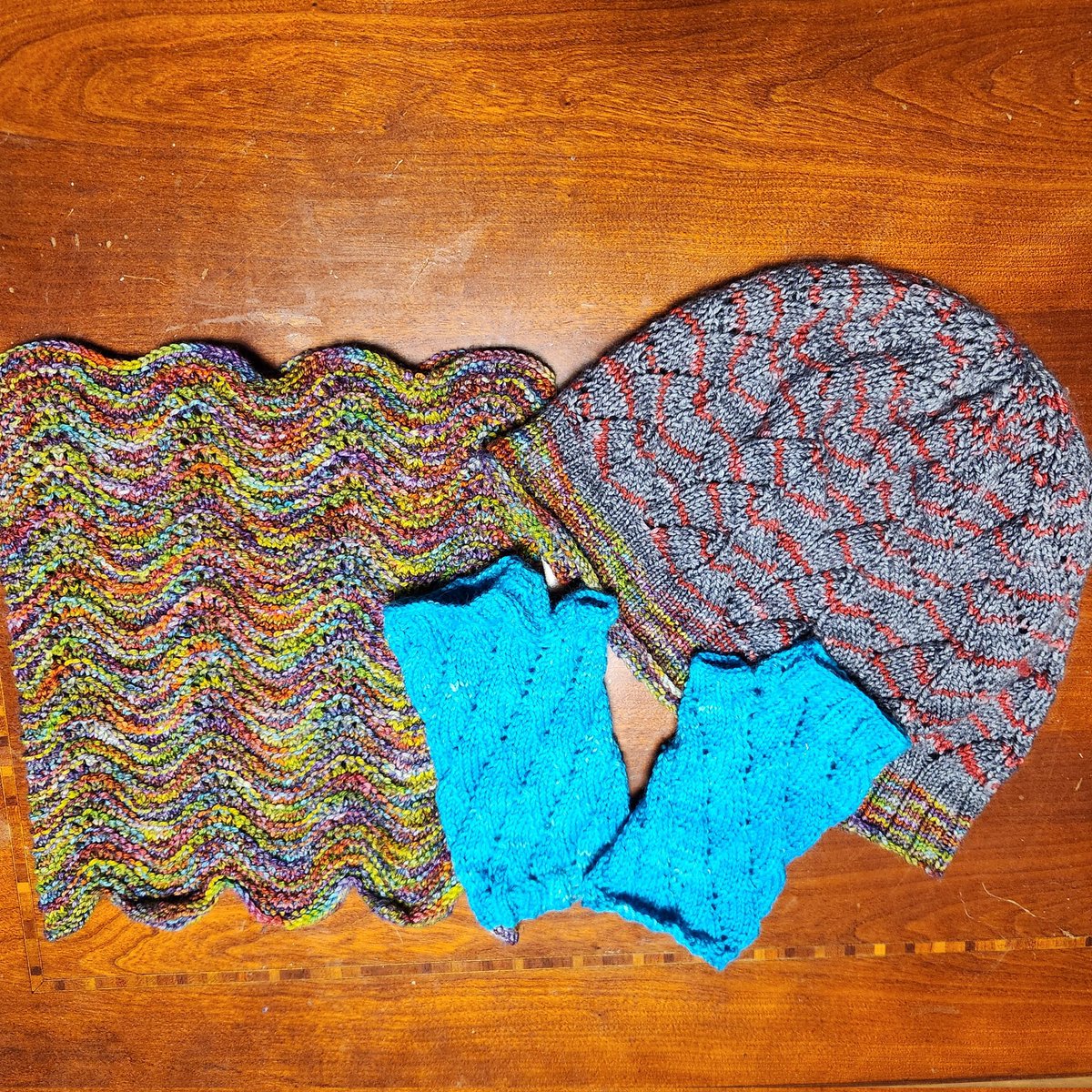 yarnalchemist's tweet photo. @adoptourcrew I knit an entire cold weather set (hat,  cowl,  &amp; fingerless gloves)  with hand dyed cashmere yarn from the OFMD collection from Seattle Dye Works. The colorways are Izzy (Dark Rainbow), Blackbeard (grey &amp;red), and Stede (teal) https://t.co/7wg6rCUJPl