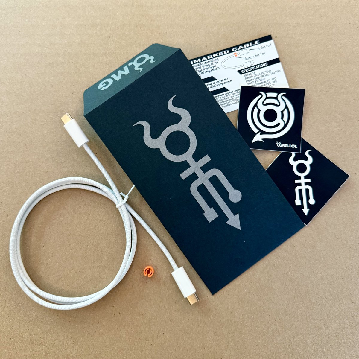 I’ve never mentioned it, but all of this is made in USA

OMG Cable finished in USA
Envelope printed in USA
Envelope made in USA
Envelope paper made in USA
Stickers made in USA
Insert card made in USA
Cable clip made in USA
And of course all of it was designed in USA

I’m not sure