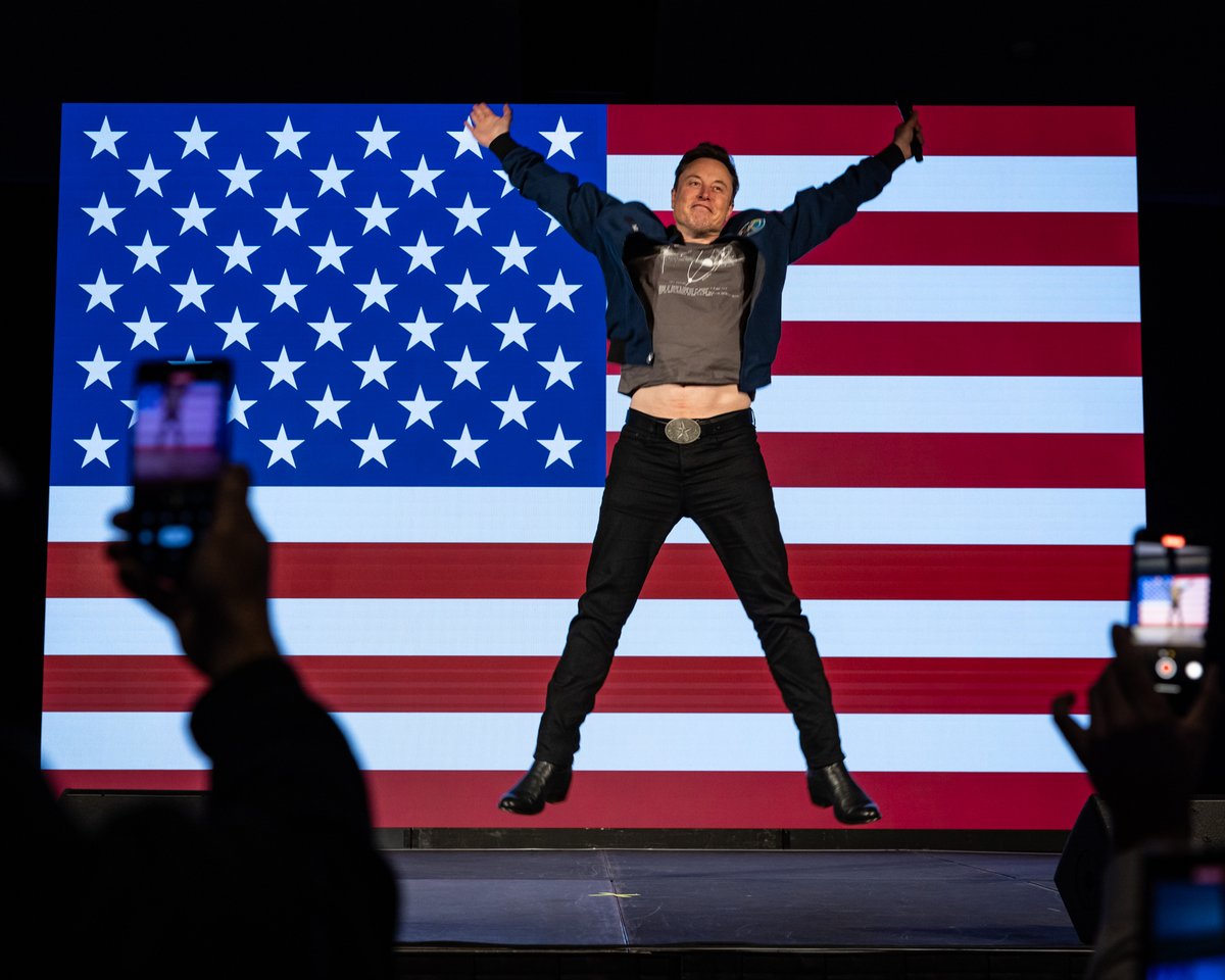 Tesla Elon Musk leaps on stage at an America PAC town hall on October 26, 2024 in Lancaster, PA. (Photo by Samuel Corum/<a href="/GettyImages/">Getty Images</a>)

<a href="/elonmusk/">Elon Musk</a> @gettyimagesnews #photojournalism #campaign 2024