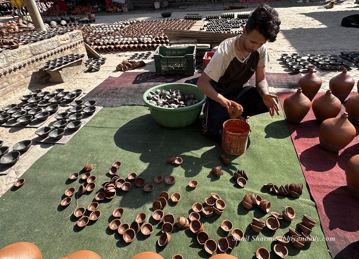 newbusinessage's tweet photo. These photos by our photojournalist @sharmasunil1905 show the community of potters busy making the traditional oil lamps at Bhaktapur’s #potterysquare on Saturday, October 26, 2024. https://t.co/9psBqOxkIO