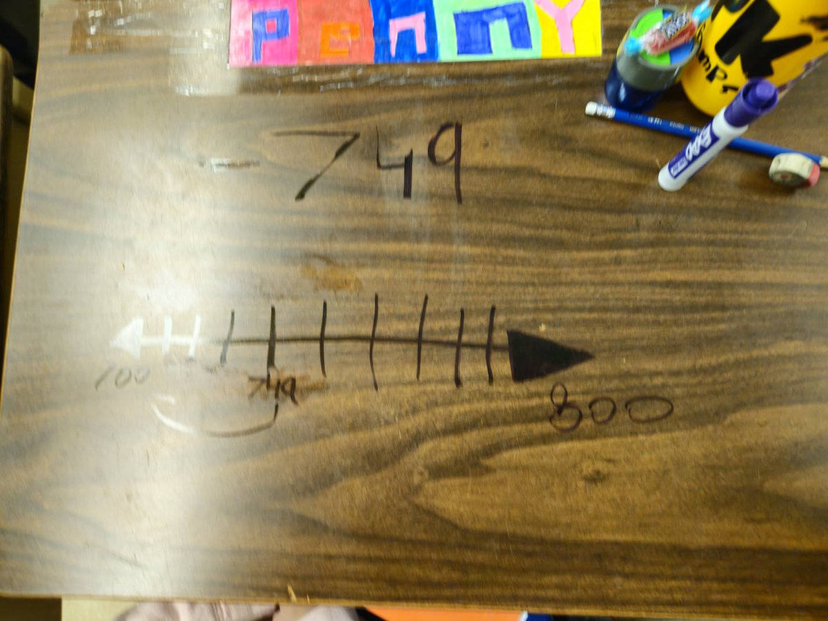 MisterQuayson's tweet photo. This week, our Grade 3s took on rounding to the nearest hundred using number lines! Together we rounded 749 to 700 and explored how numbers get closer to the next hundred. Love seeing their math confidence grow! #MathSkills #Rounding #NumberLines https://t.co/rGchHgiWZl
