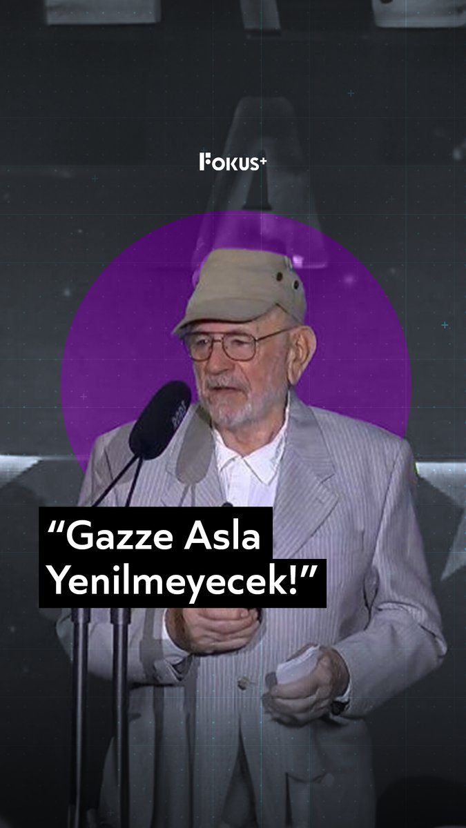Argentine actor Norman Briski speaks into a microphone wearing a cap and glasses, with the caption "Gazze Asla Yenilmeyecek!" (Gaza Will Never Be Defeated!) displayed below, alongside the "Fokus+" logo at the top.