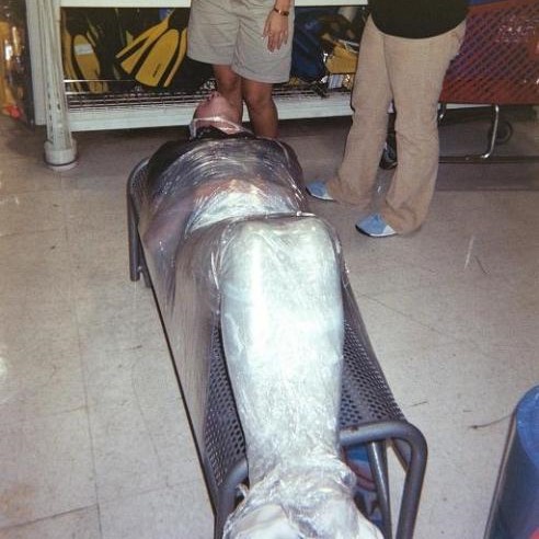 CapturedCamo's tweet photo. The college intern is welcomed by being shrink-wrapped to a bench #irlbondage #wrapped #shrinkwrapped #shrinkwrap #saranwrapped #saranwrap https://t.co/q6lxbKW462
