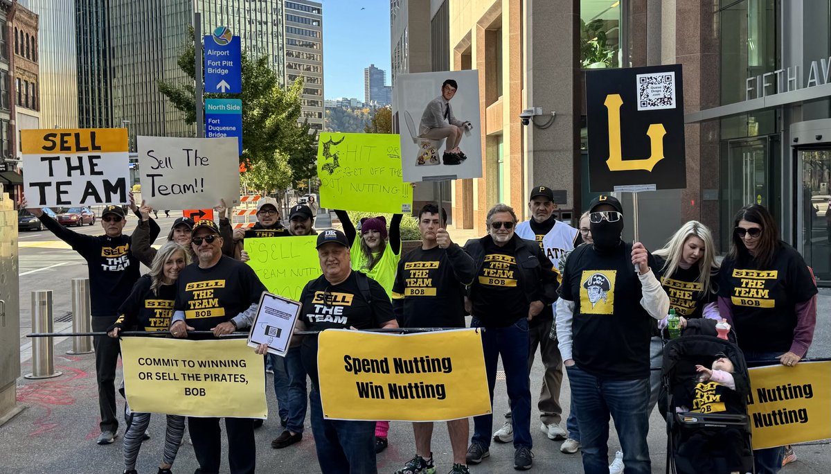 Dejan_Kovacevic's tweet photo. Protest of Bob Nutting’s ownership of #Pirates just passed by our Downtown HQ/shop. More than 30 at varying stages. Funny story: A police officer approached at one point. They thought they might be in trouble. He just asked to buy a ‘SELL THE TEAM’ shirt for himself. And got one. https://t.co/ZPqd3eElNv