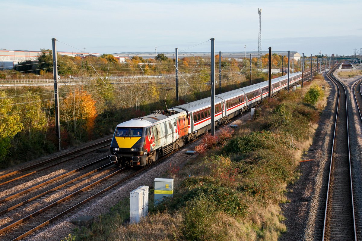 91111 + NL12 (82212) 1D18 Marholm

The best 91 of all, number 11 accelerates after its stop at Peterborough as it passes Marholm. The autumn late October rays of sunshine lighting it up on its Sunday voyage to Leeds.

<a href="/225groupuk/">225 Group</a> <a href="/LNER/">London North Eastern Railway</a>