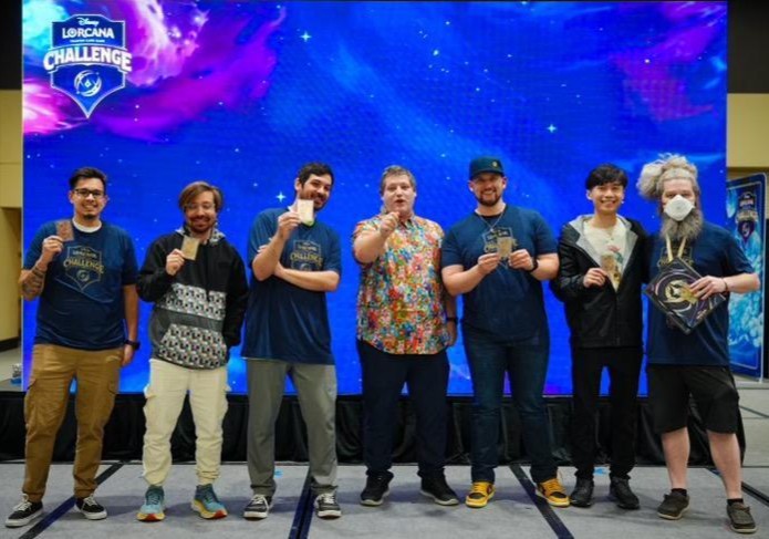DisneyLorcana's tweet photo. Luke Goodwin is your #DisneyLorcana Challenge Seattle Champion! Congratulations to our competitors on their victories this weekend!

Miss the stream or want to relive the highlights? Check out the VoDs on https://t.co/oea3OV58se!
#DLCSeattle https://t.co/60IF7gW6JX