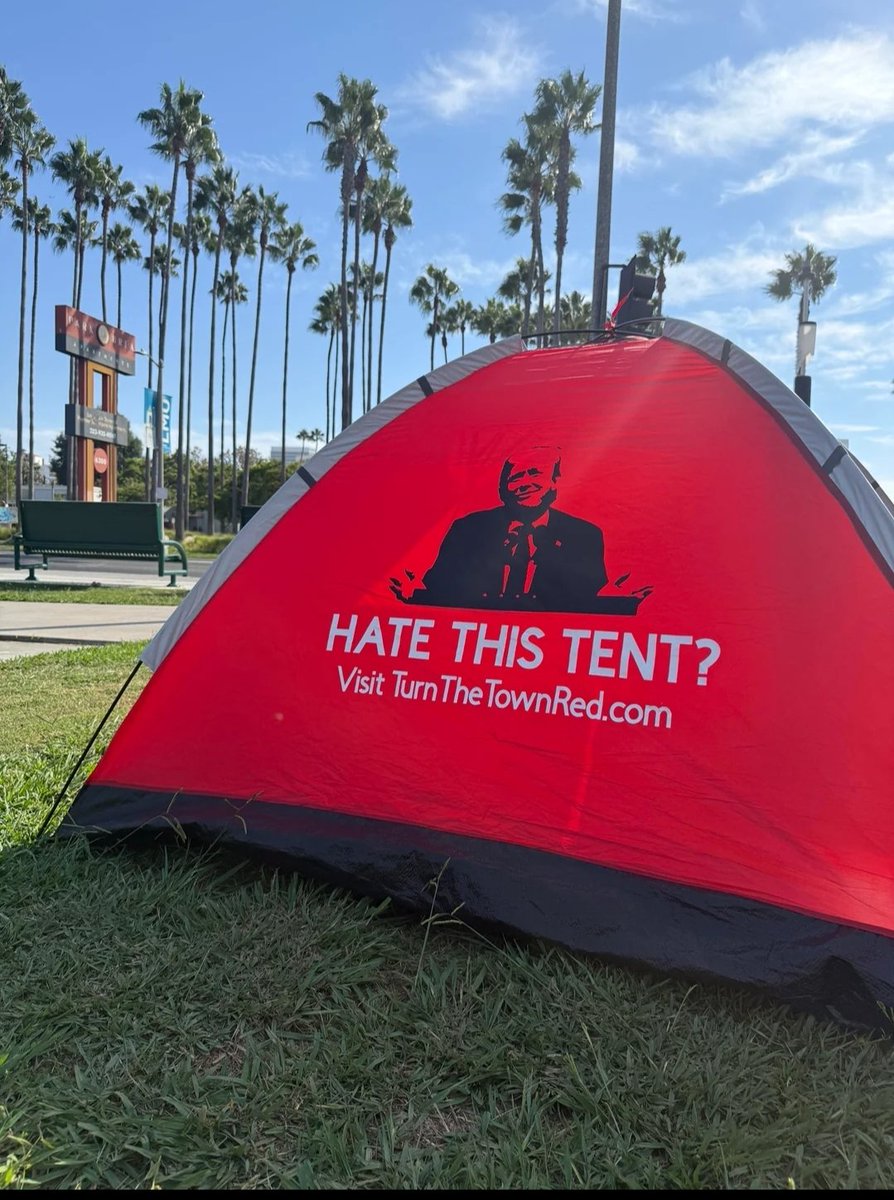 ahouse4all's tweet photo. A MAGA operative has been giving people tents advertising for Trump in Hollywood. 

Using unhoused people as billboards for a political movement that doesn't give a fuck about them by giving them something they need to survive.

Just..a truly evil depraved party. https://t.co/Ks1n1Ffb3y