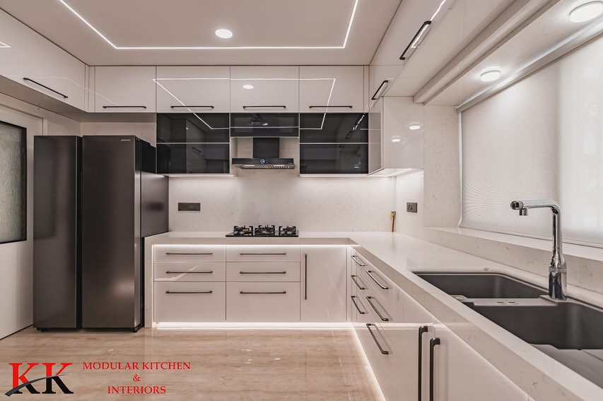 KKModularKitchn's tweet image. Behold the epitome of elegance! Our latest creation, a stunning white modular kitchen crafted with precision by KK ModularKitchen.

Anti-scratch Acrylic finish with grey glass accents adds style; Blum hardware ensures durability.
  
#BlumHardware #Kitchendesign