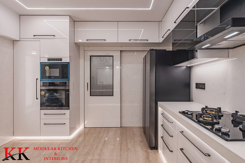 KKModularKitchn's tweet image. Behold the epitome of elegance! Our latest creation, a stunning white modular kitchen crafted with precision by KK ModularKitchen.

Anti-scratch Acrylic finish with grey glass accents adds style; Blum hardware ensures durability.
  
#BlumHardware #Kitchendesign