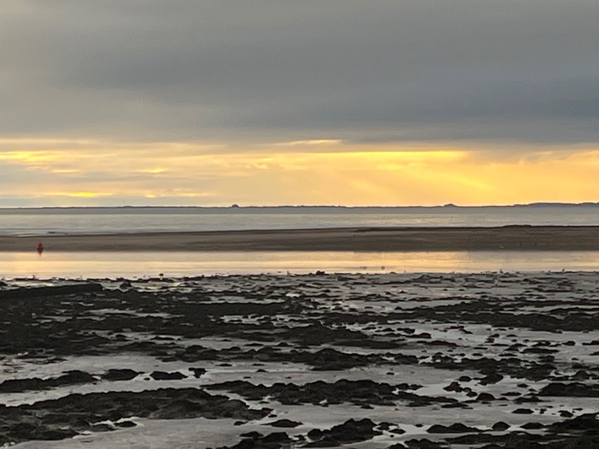 adberginwriter's tweet photo. A peaceful start to what will be a hectic week, looking across the Tweed towards the curving expanse of Spittal beach and beyond, to the golden light falling upon the castle mounds at Bamburgh and Lindisfarne. https://t.co/UkkfGU2bWh