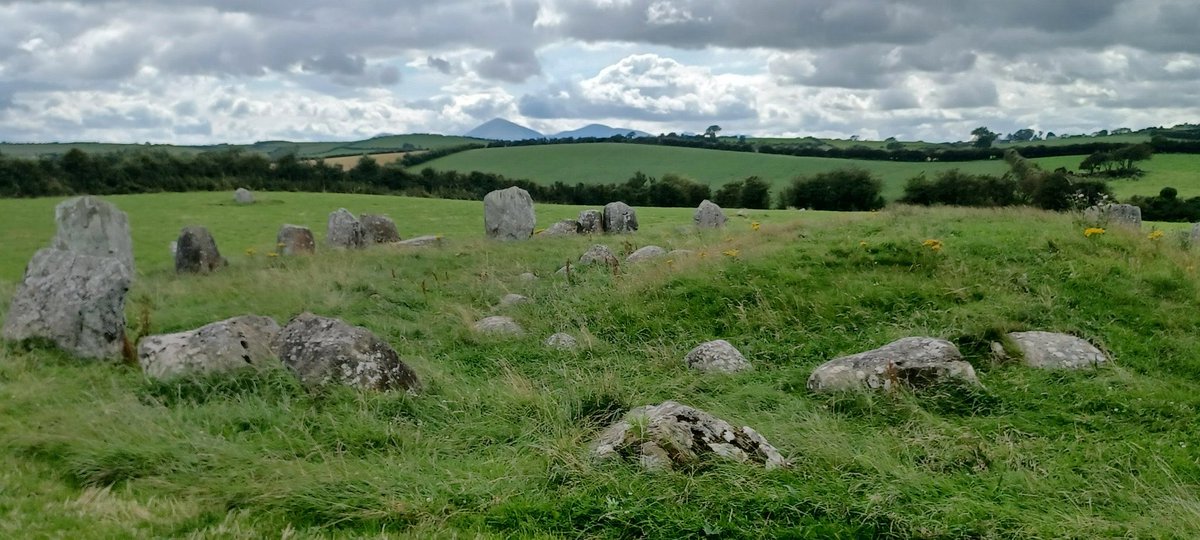 PatrickJMB's tweet photo. Ballynoe Stone Circle, with Slieve Donard and Slieve Commedagh peaking up in the distance.
#Mournes, #Lecale https://t.co/9KEyeHL5Sx